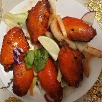 Tandori Chicken Wings · Chicken wings marinated & cooked over mesquite in tandoor.