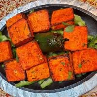Tandoori Paneer Tikka · Chunk of cheese marinated in fresh spices.