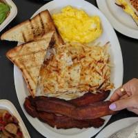 Breakfast Plate · 2 eggs, bacon or sausage, hashbrowns or breakfast potatoes, brioche toast.