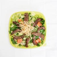 Steak Cilantro Salad · Steak, romaine lettuce, red onions, red bell peppers, corn, tortilla strips, with cilantro-r...
