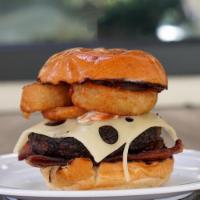 BBQ Burger · Harris Ranch beef patty, BBQ sauce, ranch, Gruyere cheese, grilled onion, Applewood smoked b...