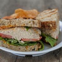 Albacore Tuna Sandwich · Red onions, tomatoes, lettuce and Sriracha aioli on 7-grain seeded Artisan bread.