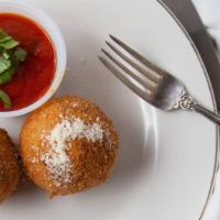 2 Arancini · Rice balls filled with ground beef, Parmigiano cheese breaded in our homemade breadcrumbs an...