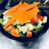 House Salad · Fresh romaine lettuce accompanied by sliced tomatoes and cucumbers served with our homemade ...
