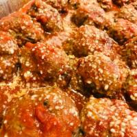 Side Meatballs · Cuzzo's famous homemade meatballs topped off with our marinara sauce. 