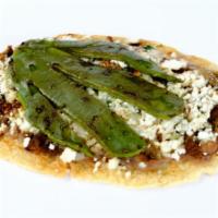 Huarache Azteca · Beans, hot salsa, queso fresco, onions & cilantro and grilled cactus.