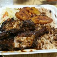Aunty Joy's Jerk Chicken · Includes rice and peas, steamed cabbage and fried plantains.