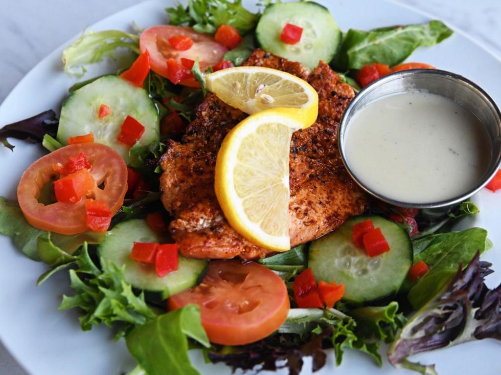 Wood-Fired Salmon Salad · Salmon, greens, red bell peppers, tomatoes and cucumbers with lemon vinaigrette dressing. Gluten free.