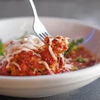 Mama's Meat Lasagna · Homemade lasagna with Italian sausage and meatballs, topped with red sauce and melted mozzar...