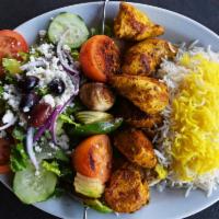 Shish Kabob · Herb marinated kabobs grilled to perfection and served with basmati rice, a vegetable skewer...