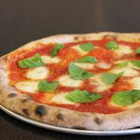 Classic Margherita Pizza · Signature marinara, extra virgin olive oil, fresh mozzarella, fresh basil and oregano.