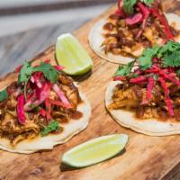 street tacos east side · shredded chicken tinga with ranchero salsa and pickled watermelon radish