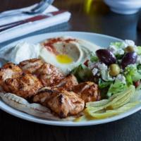 Chicken Tawook · Chicken breast, garlic sauce, wild cucumber pickles. Served with pita bread + your choice of...