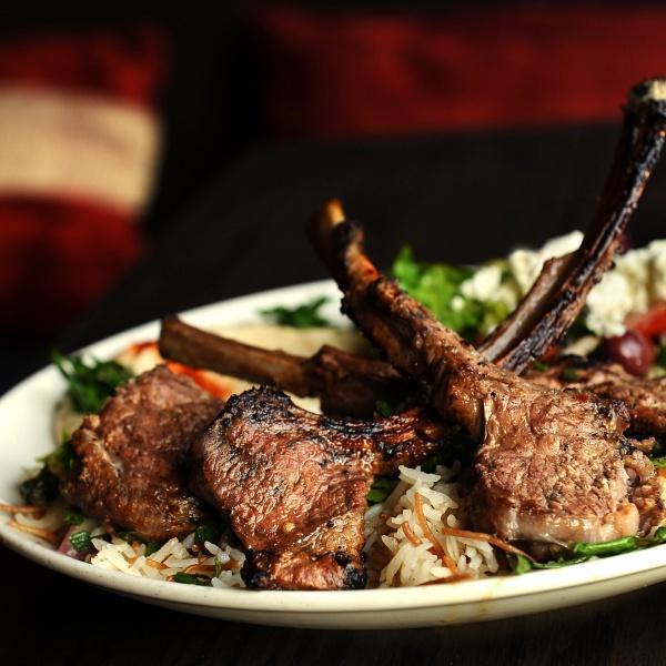 French Cut Lamb Chops · Lemon juice, garlic, extra virgin olive oil, parsley, onion, sumac, basmati rice. Served with pita bread + your choice of one dip & one salad - hummus, spicy hummus, baba ghannouj | open sesame salad, fattoush, tabouleh