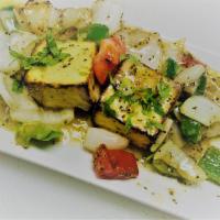 Paneer Tikka · 2 pieces. Tender pieces of homemade cheese marinated in spices and cooked on skewer in tando...