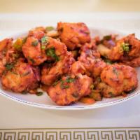 Gobi Manchurian · Cauliflower florets batter fried and coated with chili soy sauce.