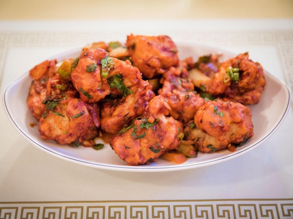 Gobi Manchurian · Cauliflower florets batter fried and coated with chili soy sauce.