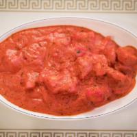 Chicken Tikka Masala Specialty · Pieces of chicken tikka cooked in a creamy sauce with fresh tomato, and exotic spices.