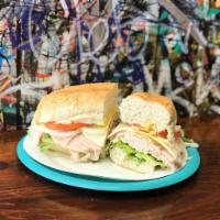 Turkey Breast Sandwich · Lettuce, tomato, onions, mustard, mayo, Italian dressing and provolone cheese, made on a Fre...