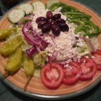 Greek Salad · Mixed greens, tomatoes, cucumber, onions, green peppers, Greek olives, pepperoncini and our ...