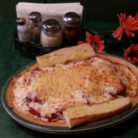 Chicken Parmesan · 2 boneless chicken breasts topped with melted mozzarella and Parmesan cheeses over spaghetti...