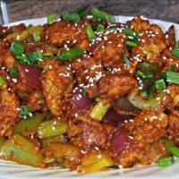 Chili Chicken · Chicken stir fried with green bell peppers, soy sauce, garlic, ginger, green chili, chopped ...