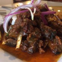 Goat Pepper Fry · Tender goat pieces cooked in spices with fresh ground black pepper.