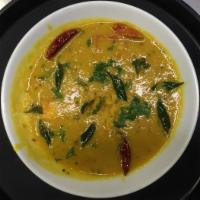 Dal Tadka · Yellow lentil cooked with onions, tomatoes and tempered with hot oil with spices.