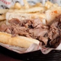 Italian Beef Sandwich · A sandwich composed of thin slices of seasoned roast beef, simmered and served with au jus o...