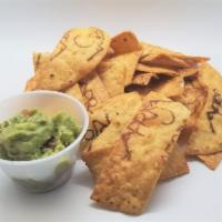 Chips and Guacamole · House-made and branded chips with our fresh gauc!