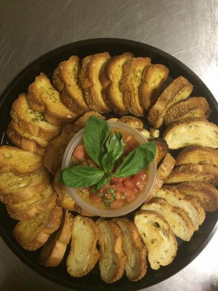 Bruschetta · 6 pieces. Toasted seasoned crostini served with tomato, garlic, olive oil and basil.
