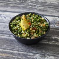 Tabouleh · Cracked wheat, minced tomatoes, fine chopped parsley, and dried mint salad topped with olive...