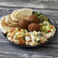 Vegetarian Combination · Hummus, baba ghanoush, 3 falafels, and tabouleh served with a Jerusalem salad and pita bread. 