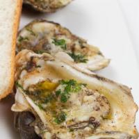 Oyster Italy · Grilled oyster topped with Italian herb, butter, Romano and Parmesan cheese.