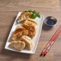6. Dumpling · 8 pieces. Filled pork and vegetables  dumplings  Steamed or fried.