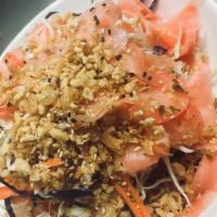 Young Ginger Salad · Young ginger roots, carrot, cabbage, peanut and sesame seeds tossed with Thai dressing.