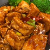 General Tao Tofu · Deep fried tofu sauteed with tangy sauce and steamed broccoli