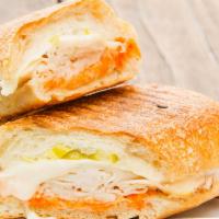 Tacchino Sandwich · Oven-roasted turkey, spicy red pepper spread, provolone cheese and peperoncini on a ciabatta...