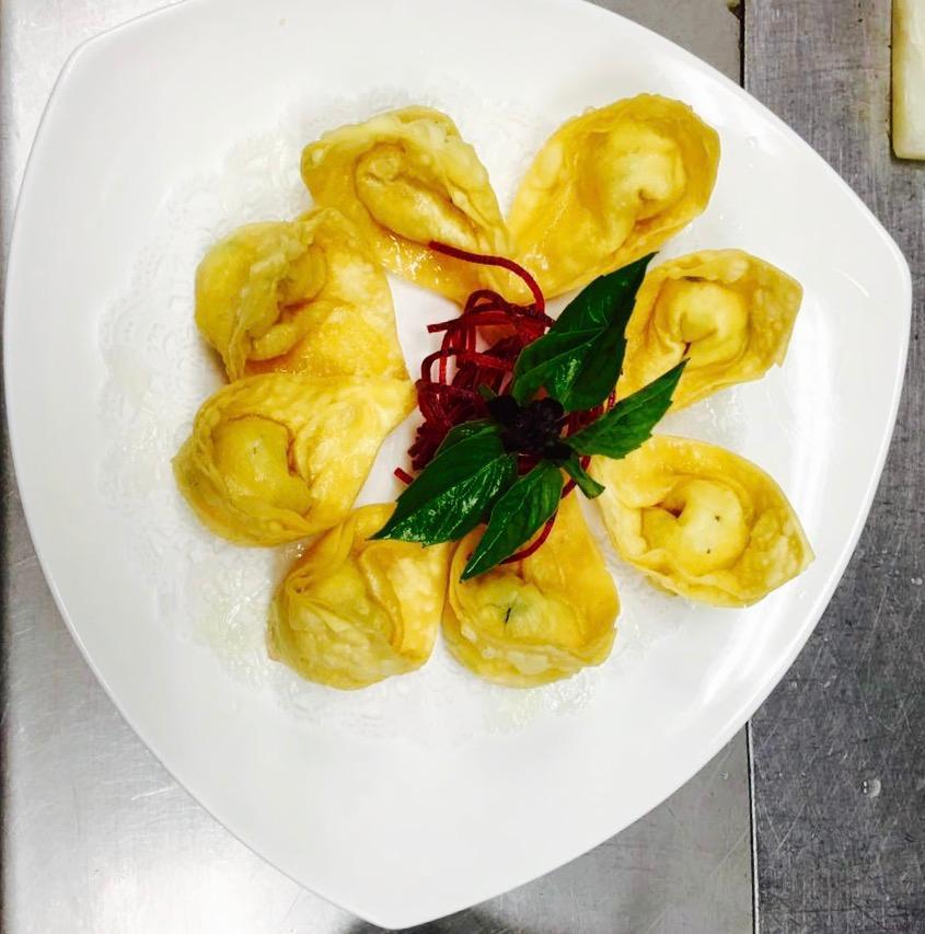 8 Crab Rangoon · Wonton-skin wrapped crabmeat, celery and cream cheese with sweet chili sauce.