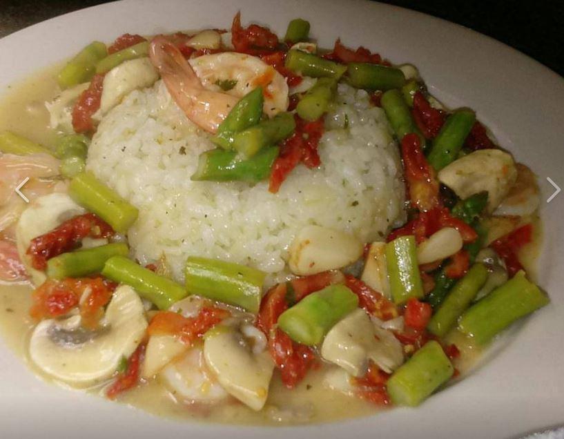 Rissoto Scampi · In white wine, butter, and garlic with sundried tomatoes, shrimp, asparagus, and mushrooms.