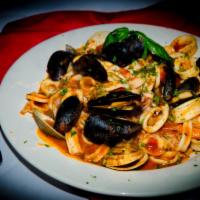 Pasta Pescatore · Calamari, clams, and mussels sauteed in marinara sauce over the pasta of your choice.