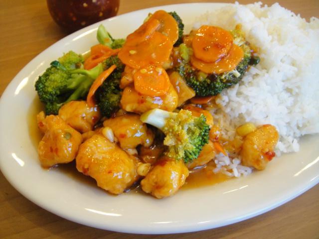 Spicy Korean Chicken · Chili vinegar sauce, garlic, scallions, broccoli and carrots.
