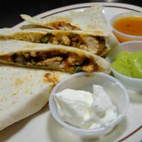 Chicken Quesadilla · Grilled chicken, bell green peppers, tomatoes, grilled onions and Jack and cheddar cheeses. ...