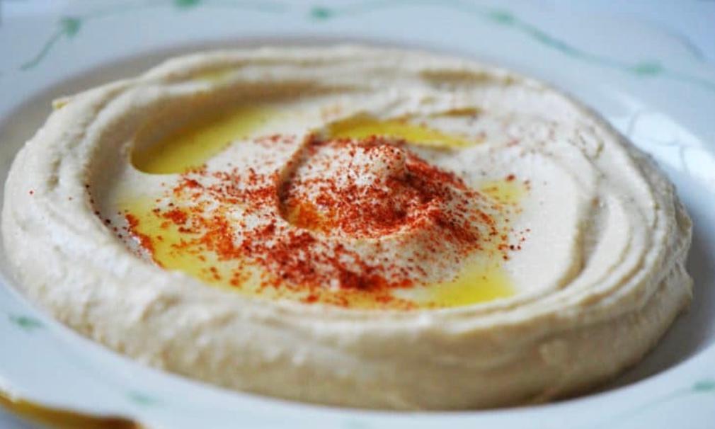 Hummus · Mashed chickpeas blended with tahini, olive oil, lemon and garlic.
