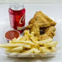 3 Piece Fried Chicken Combo Meal · One leg, 1 thigh, and 1 breast. With fries and a canned soda.