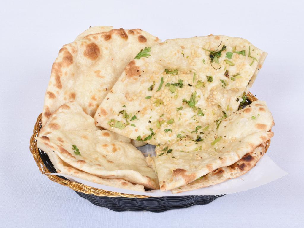Garlic Naan · With fresh garlic. From the tandoor.
