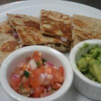 Quesadilla with Pineapple Salsa · Whole wheat tortillas, plant-based cheese, soy protein and organic spinach with a side of pi...