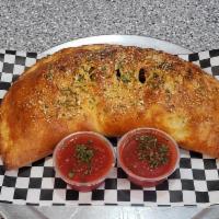 Veggie Calzone · Mozzarella cheese, ricotta cheese, grated Parmesan cheese, spinach, mushrooms and onions. Se...