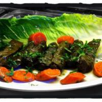Homemade Hand Rolled Grape Leaves · Our signature homemade grape leaves are stuffed with rice, vegetables and herbs, rolled by h...
