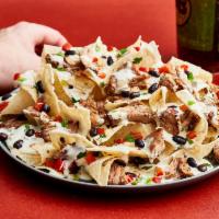 Nachos · Served with your choice of beans, Moe's Famous Queso, and pico de gallo. Protein options inc...